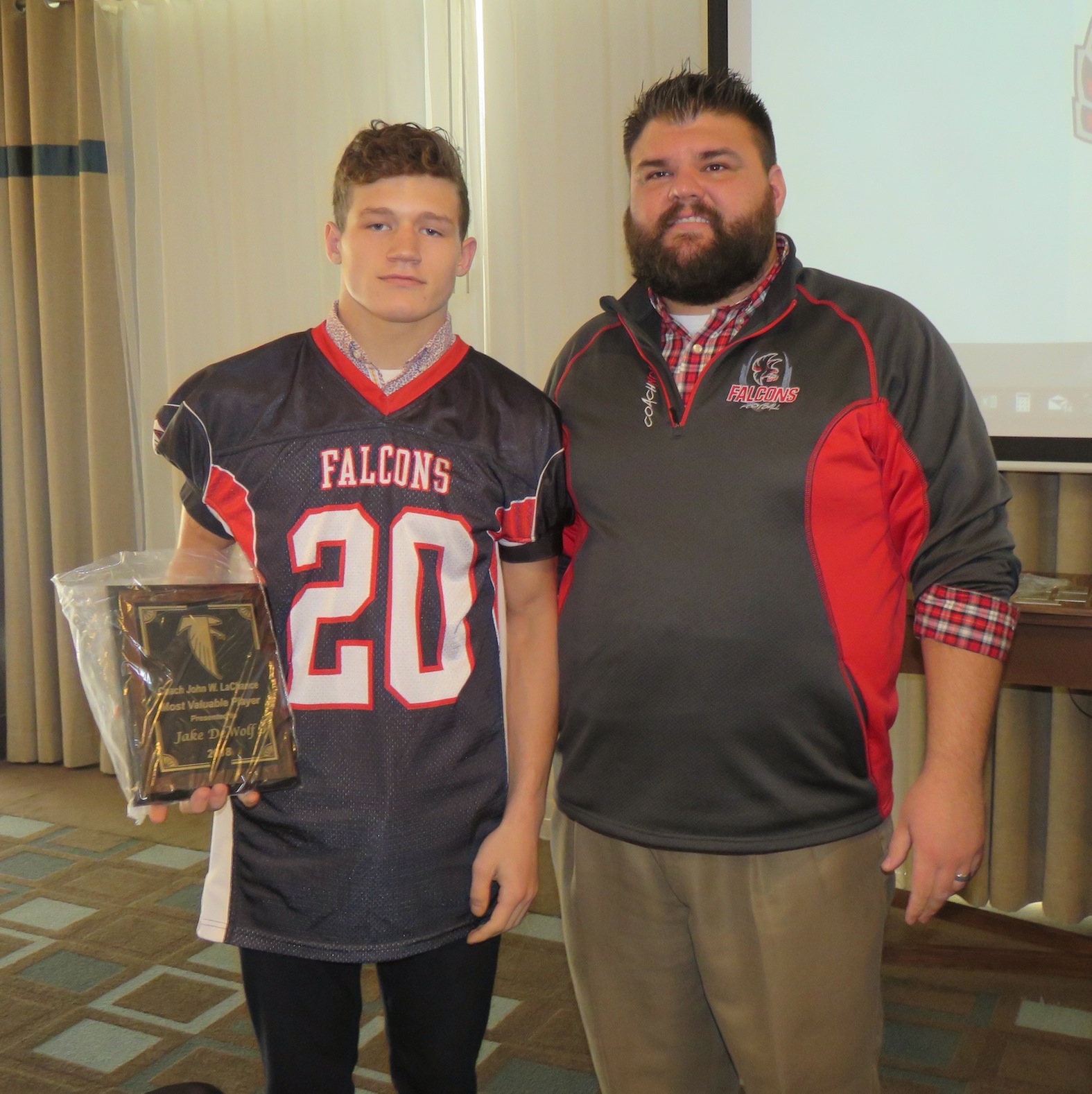 Jake DeWolf, left, is pictured with Falcons coach Russ Nixon after receiving the 2018 Coach John W. LaChance Most Valuable Player award. (Photos by David Yarger)